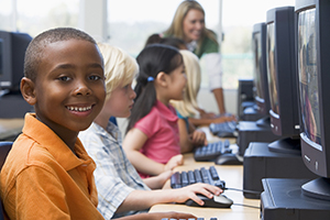 Students doing an online scavenger hunt in computer lab.