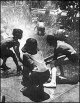 Kids playing in the water in the summer